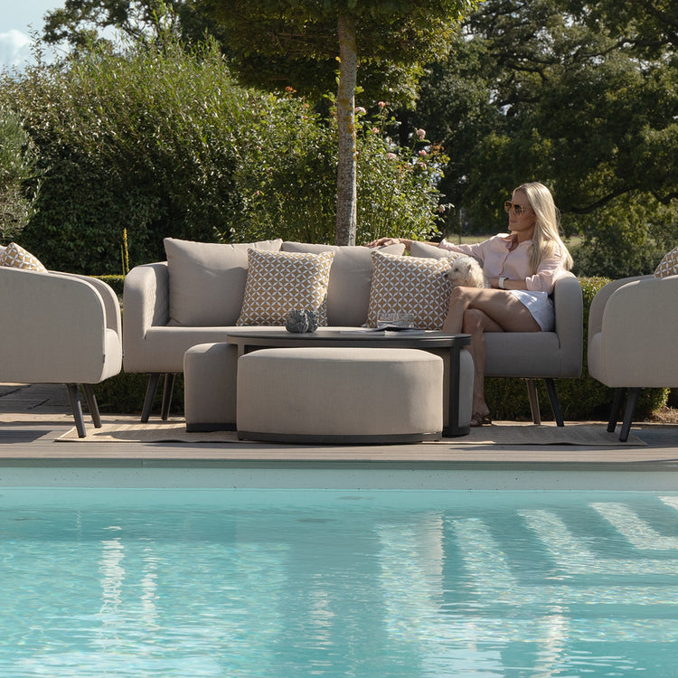 Maze Round Coffee Table With x3 Footstools Lifestyle By Pool-Better Bed Company
